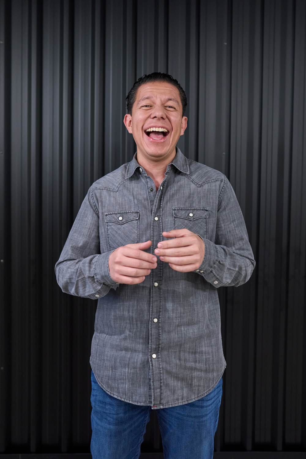 male employee at amazon mexico city laughs 