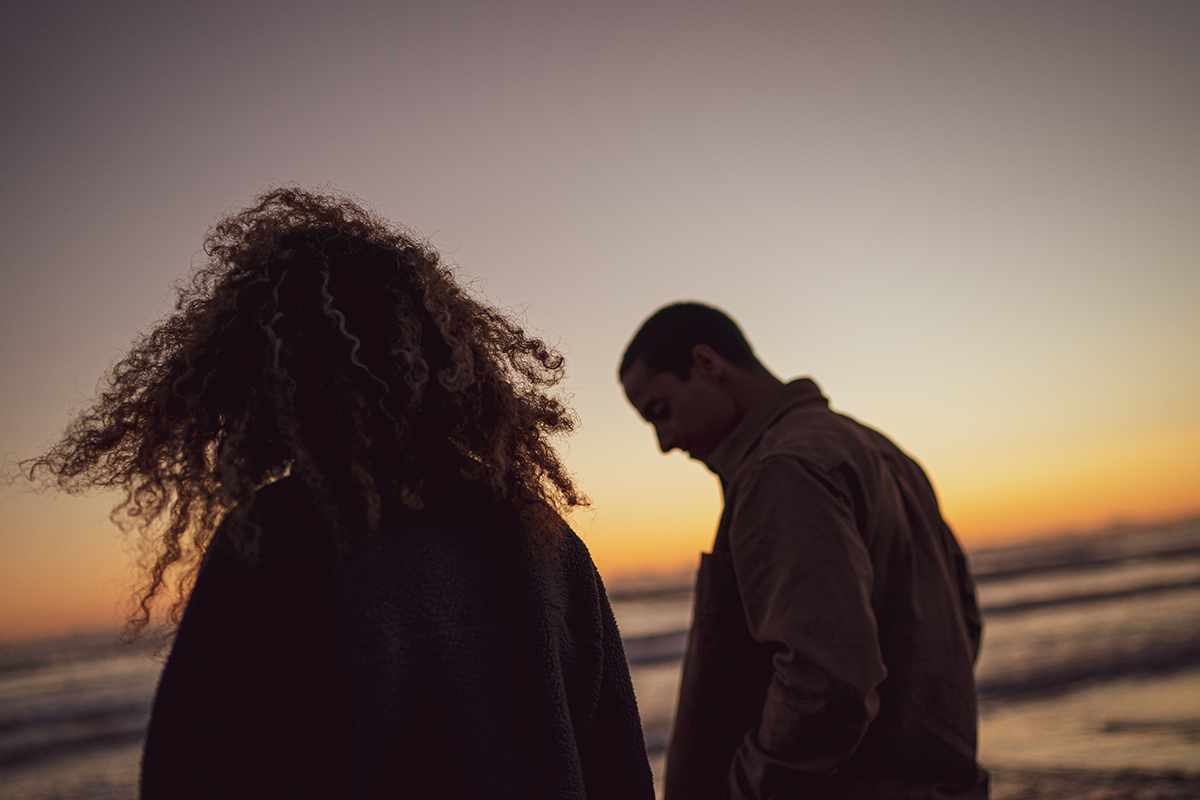 Candid photography, nighttime photographer romantic date by the sea