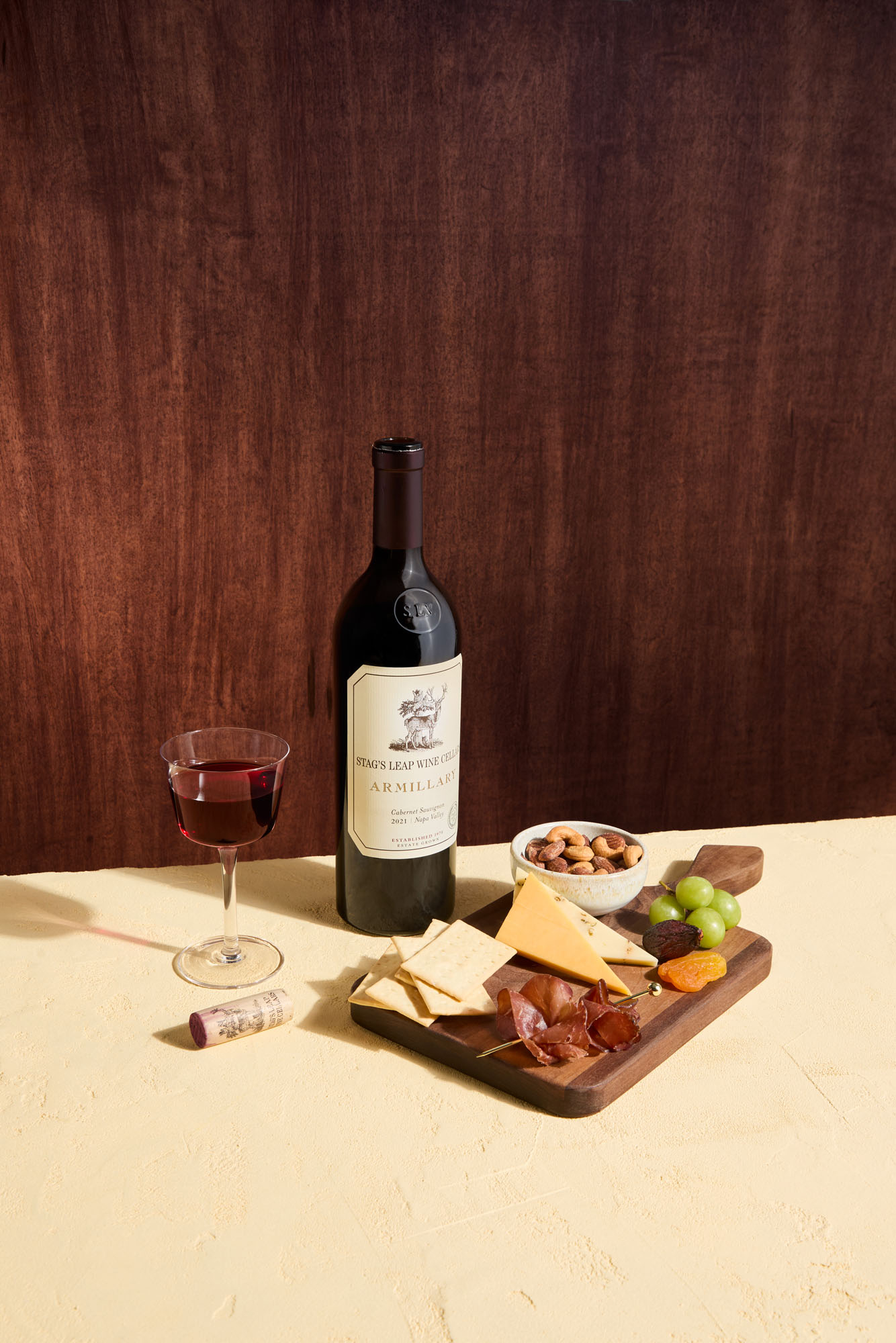 airline charcuterie board with cheese, meats, fruits and nuts 