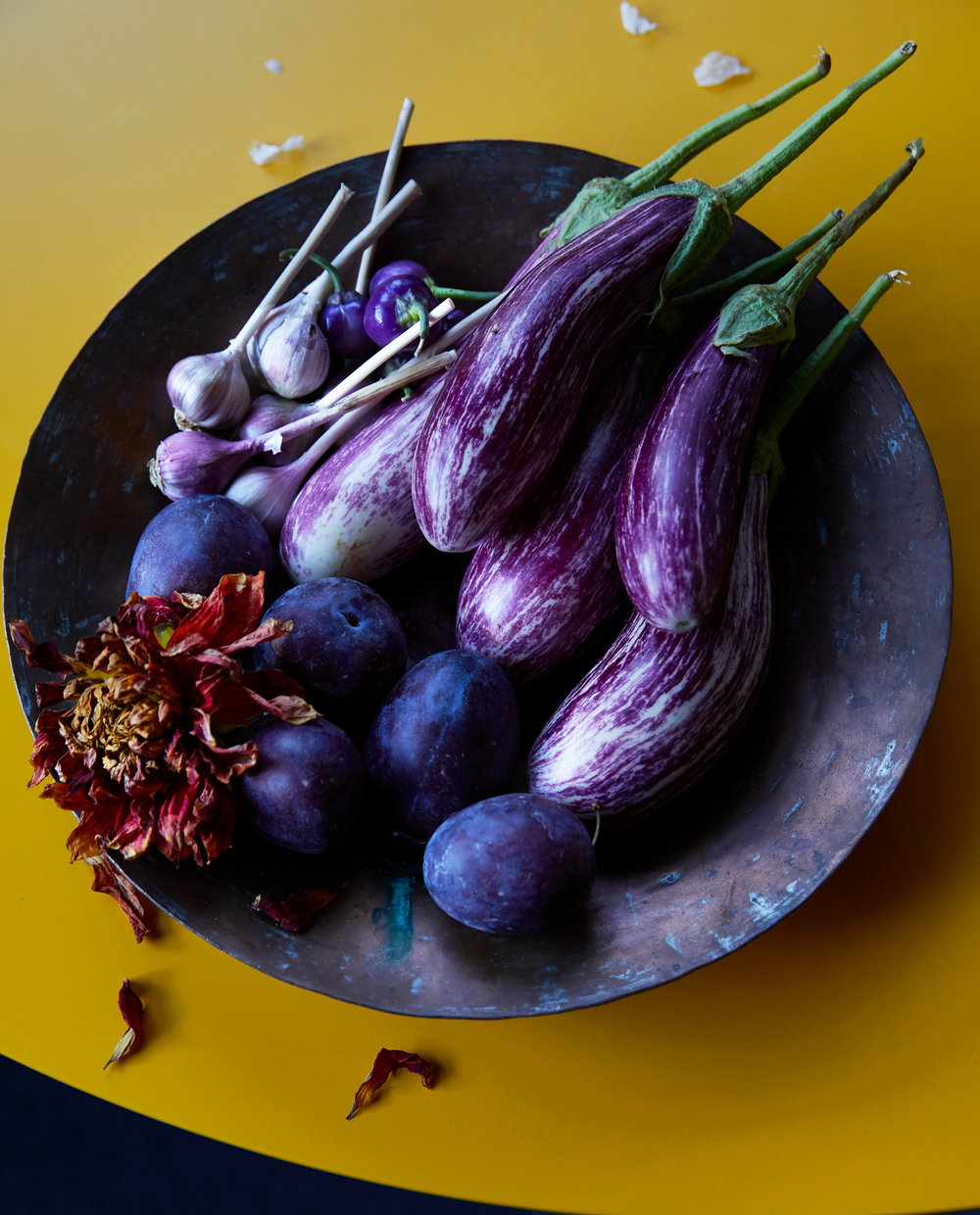 Eggplants on yellow table savory food styling by Rachel Grunig of Sally Bjornsen Represents eggplant_plums_George_RachelFall17_056b.jpg