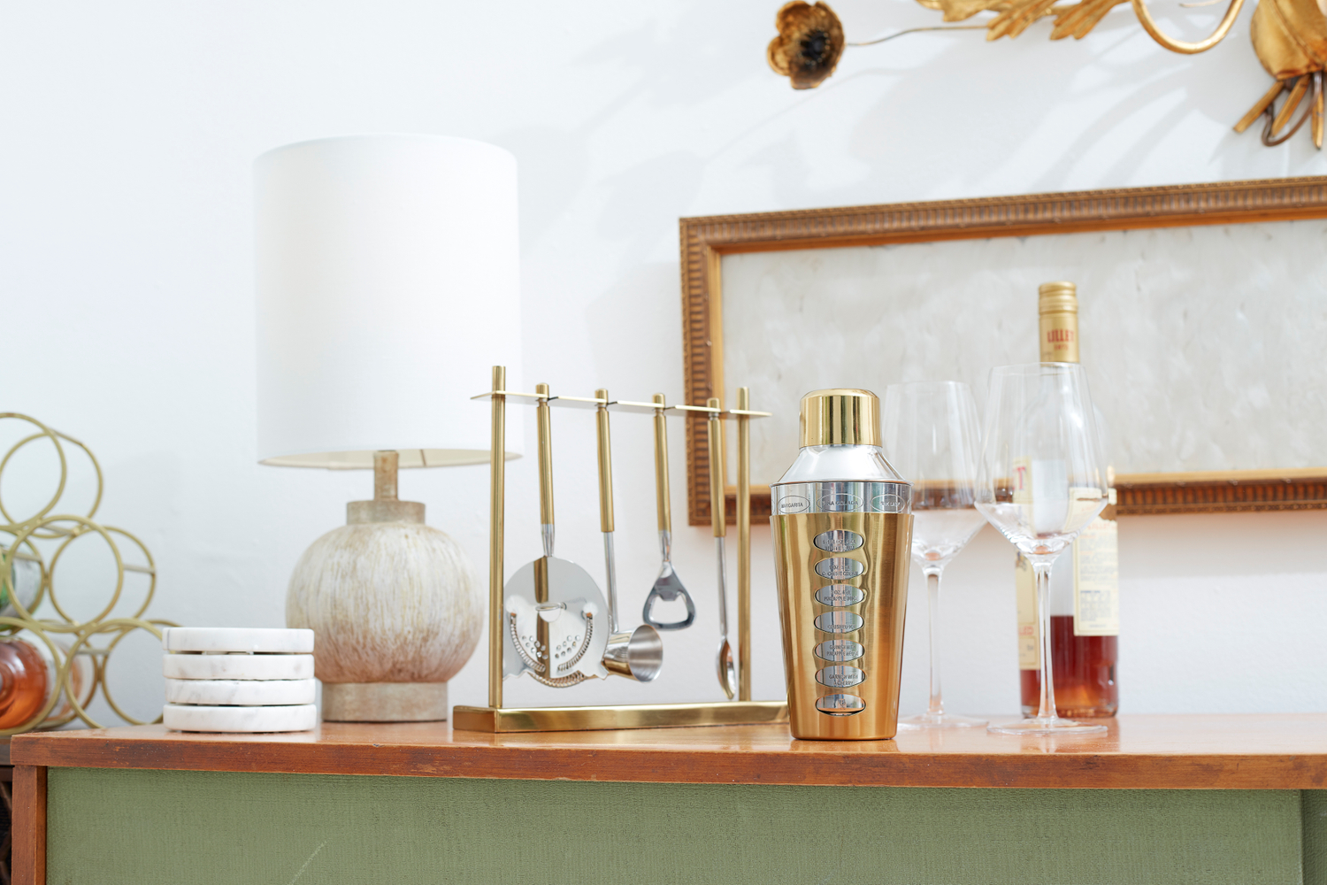 cocktail shaker in gold, table top style, bar style, how to style a bar, ideas for serving guests, bar at home mid-century bar accessories
