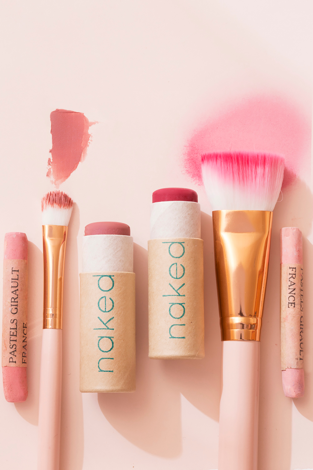 Fun and enticing cosmetics photography for beauty advertising campaign by top Seattle photographer Naked makeup in bright and earthy pink blush tones