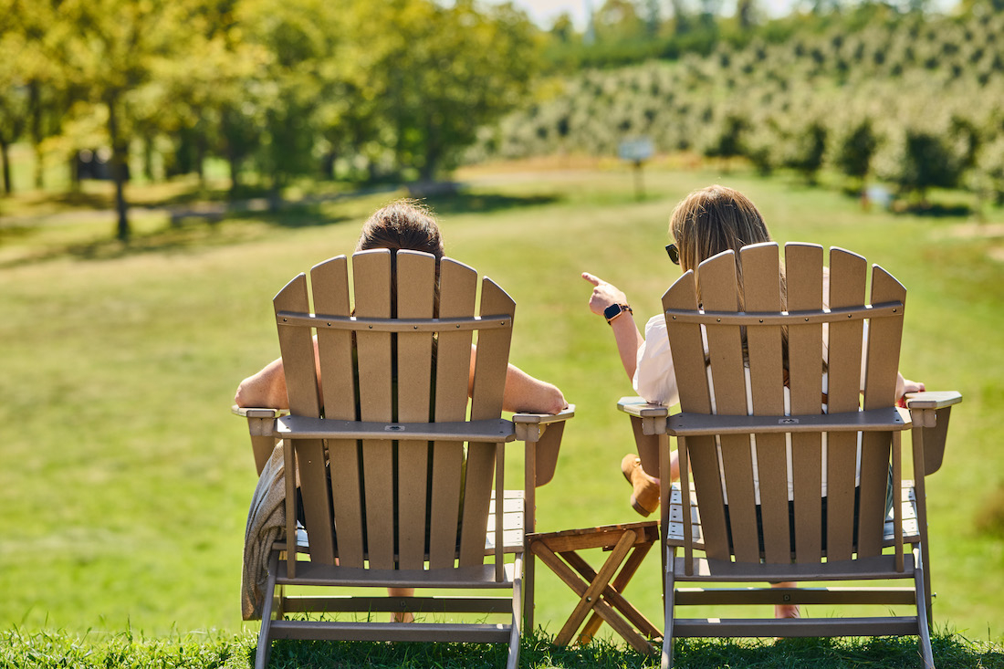 two friends enjoy a day at the apple orchards 