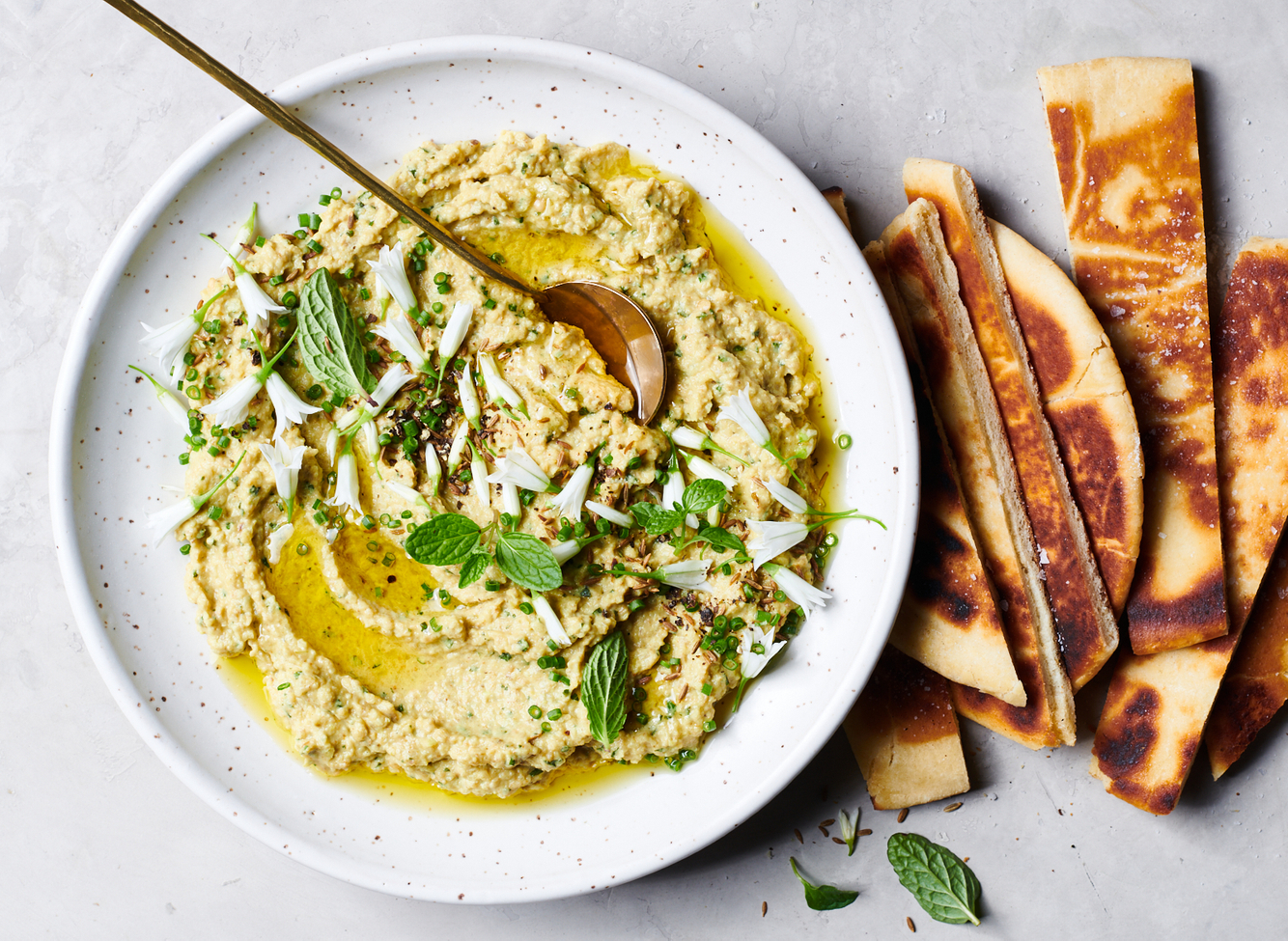 Spring hummus and oil with mint dip and flatbread