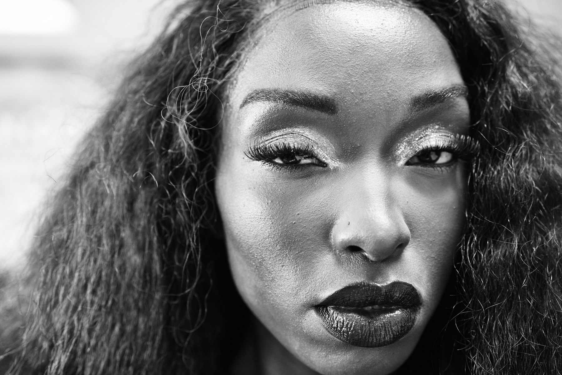 black model stares into camera backstage 