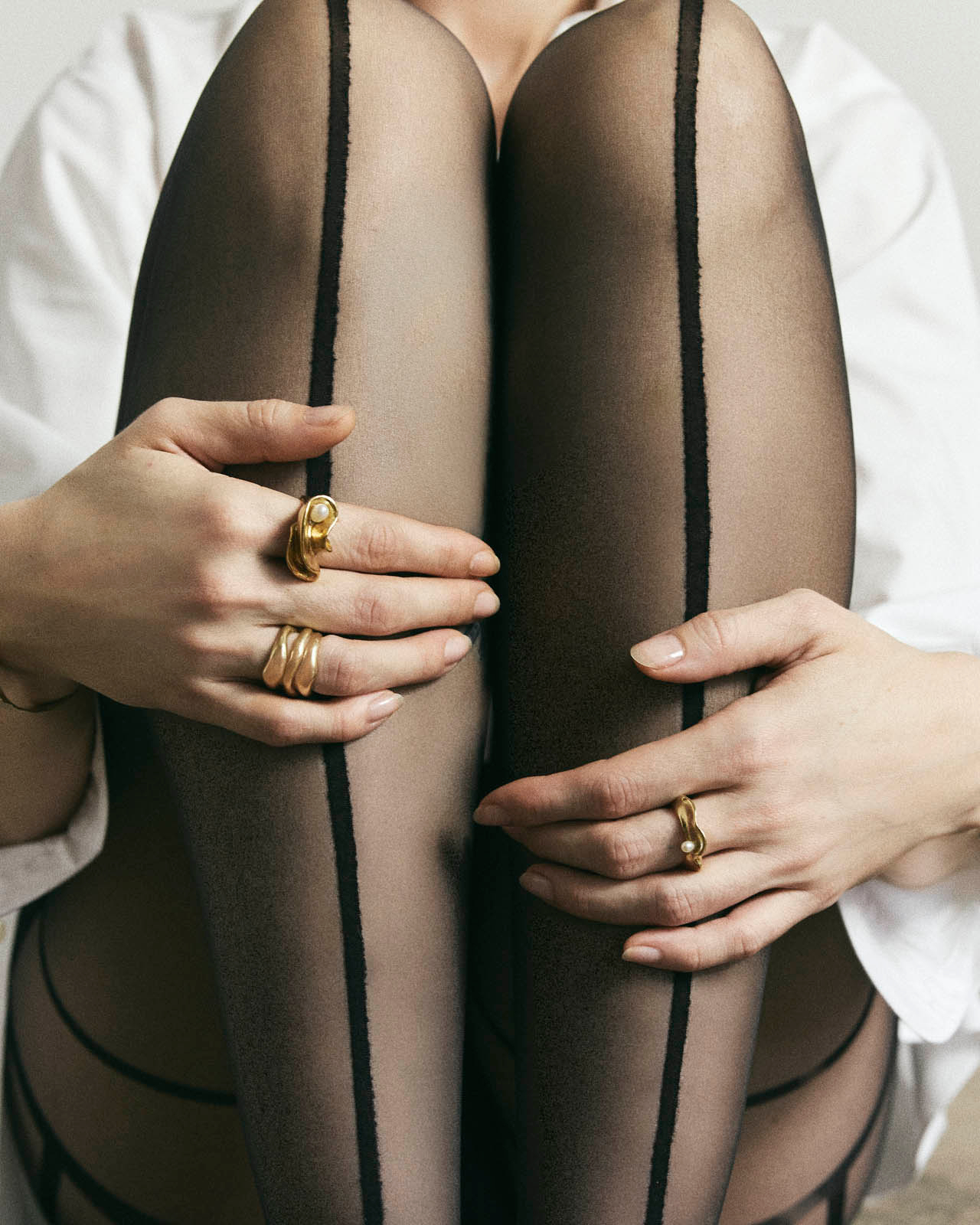 pinstripe tights with gold jewelry 