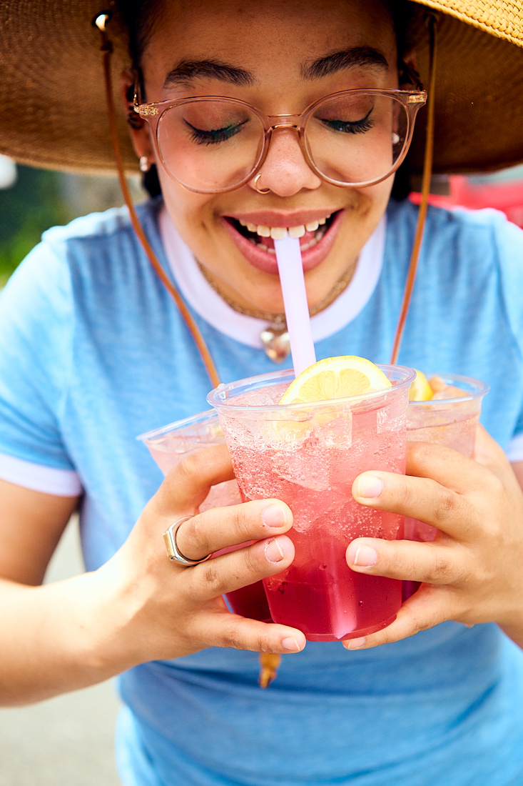 young gen z girl sips fun lemonade 