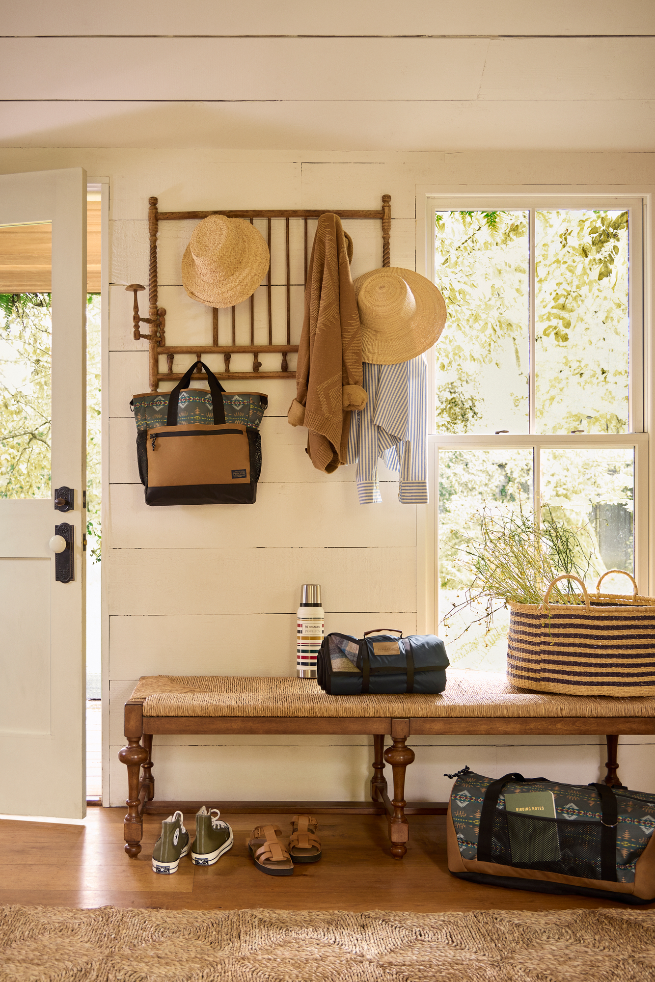 Cabin entryway with coat hanger and bench Entry way