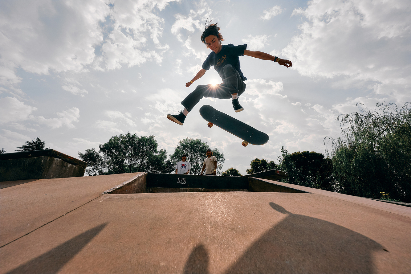 seattle based lifestyle and sports photographer Troy Nebeker for BumperShoot teen kick flips skateboard