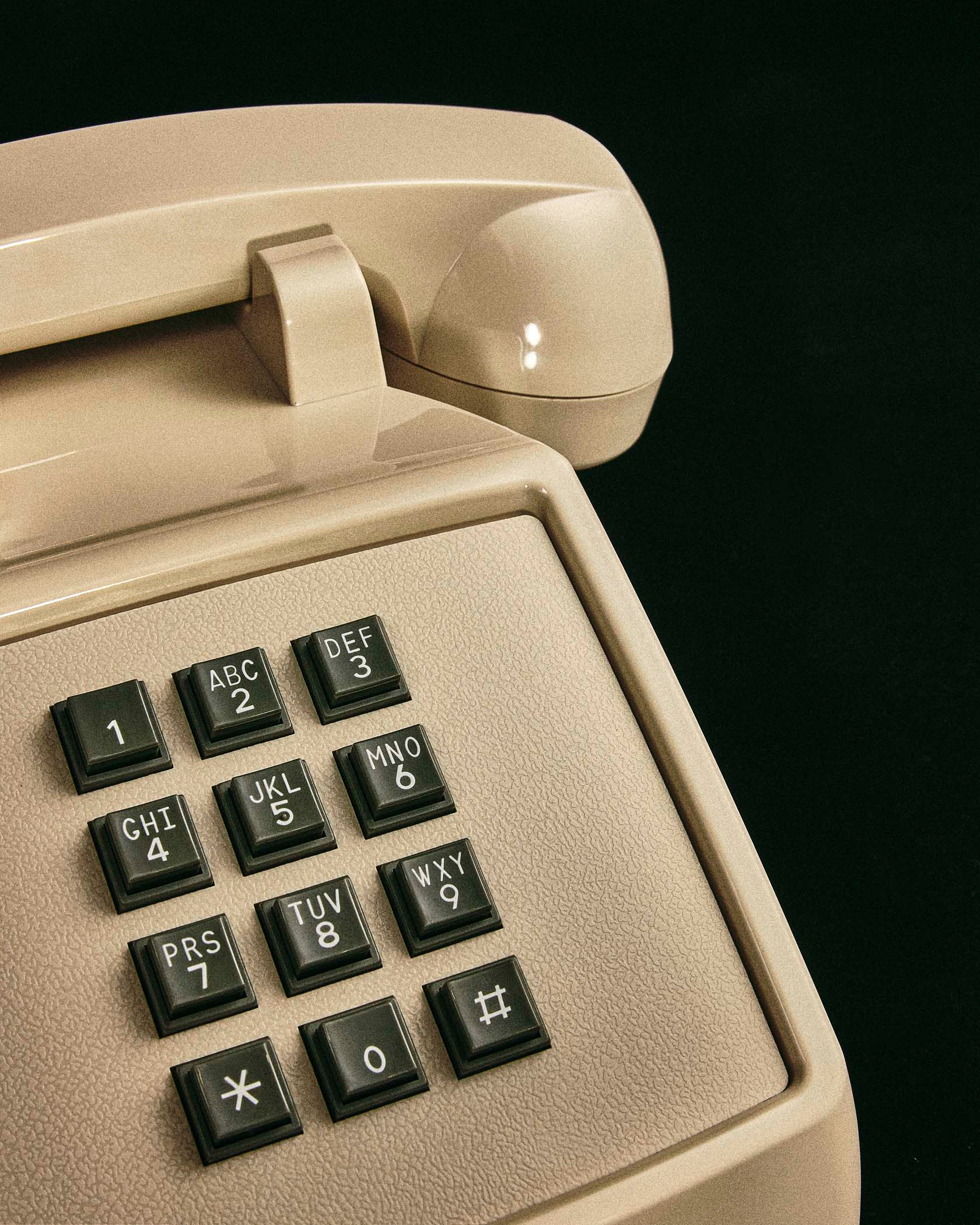 white vintage telephone photographed by product photographer Alison Blomgren ganni accesories by Alison Blomgren