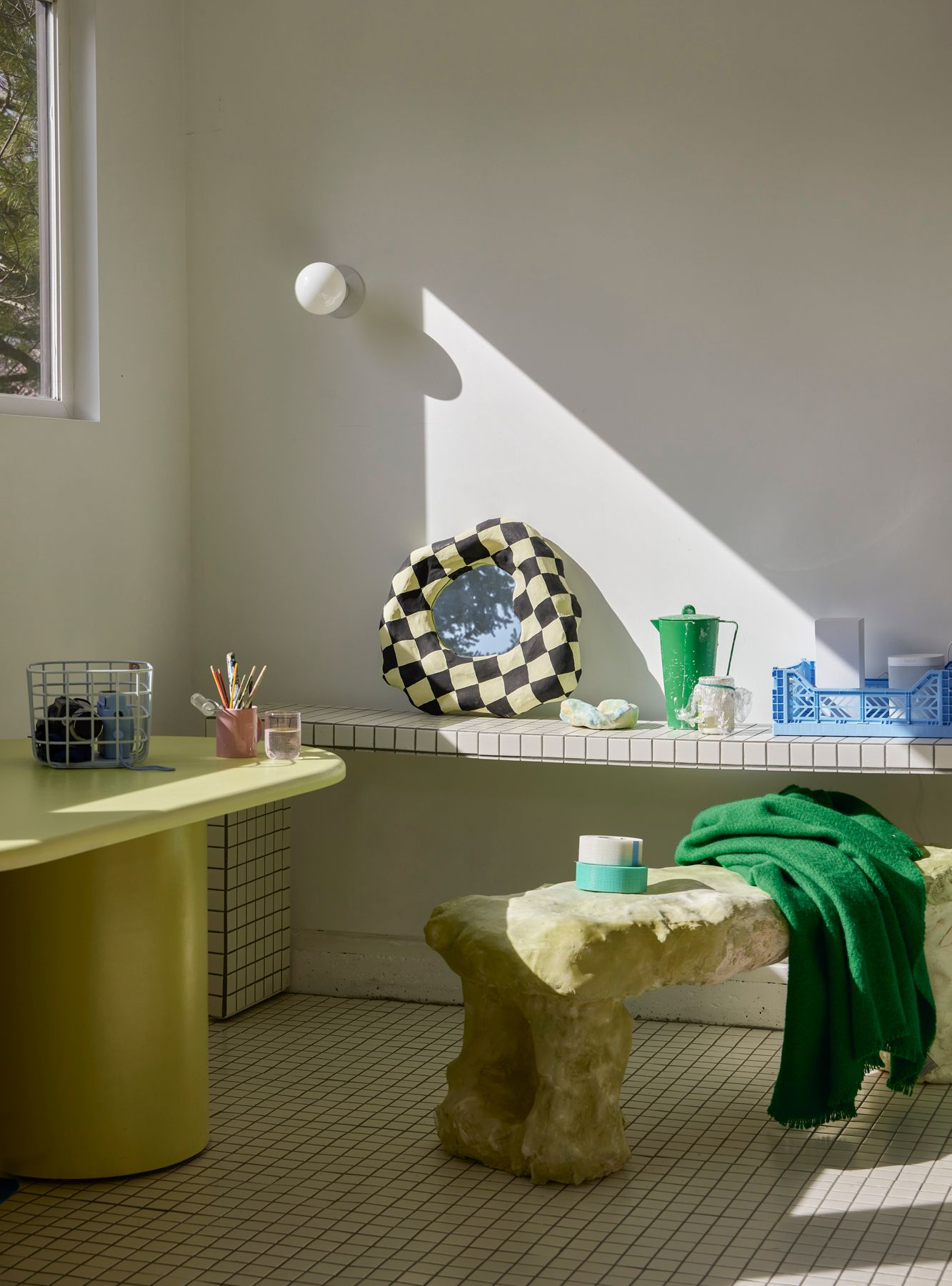 Morning light shines into white bathroom with green and white accents - by photographer george barberis George Barberis Photo Of Bathroom For Domino
