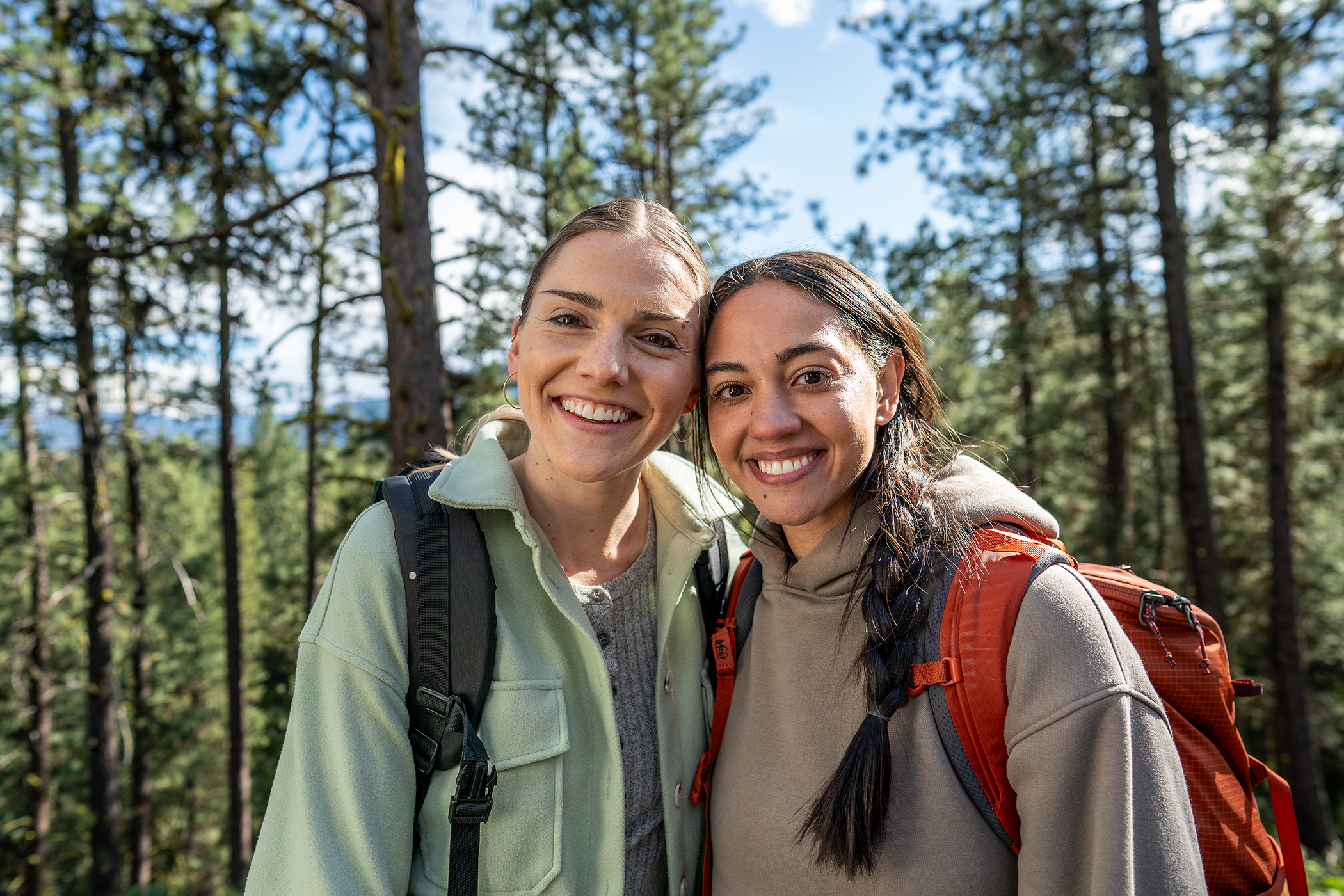 two girlfriends hiking in the forest seattle based lifestyle photographer Troy Nebeker