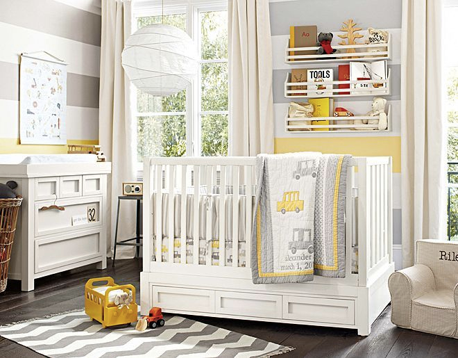 Yellow accented baby room 