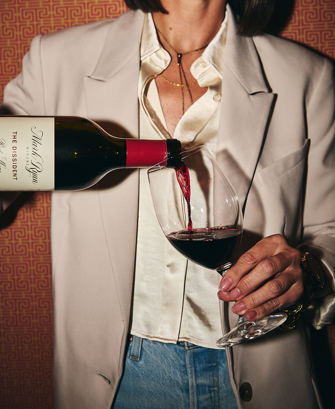 woman pouring red wine 