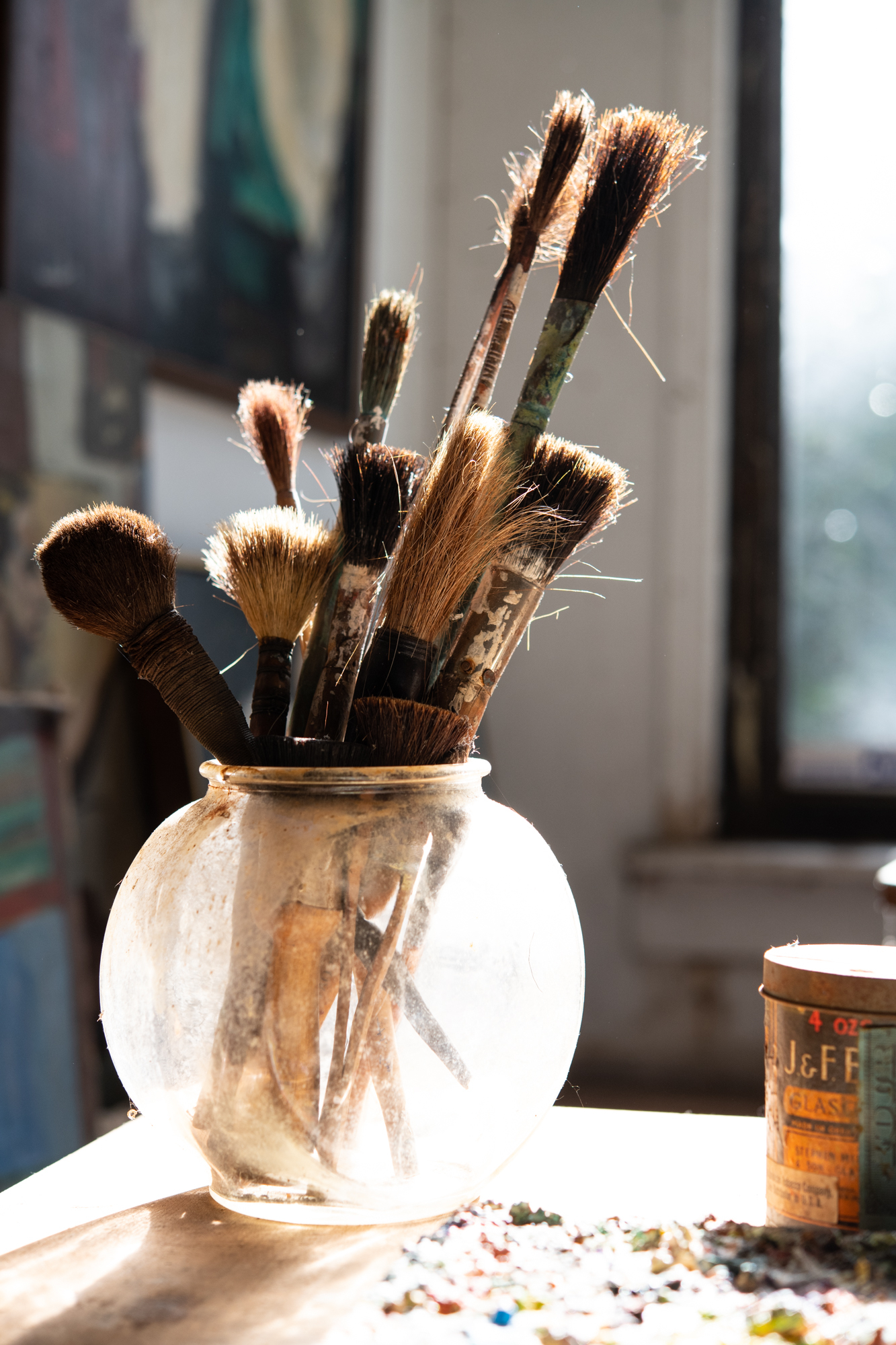 worn paintbrushes jar