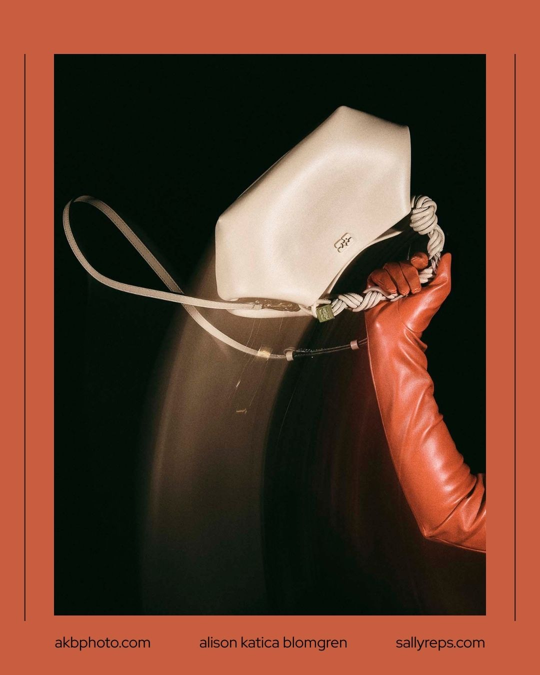 red gloved hand swings a off white ganni handbag into frame by accesory photographer Alison Blomgren Ganni Handbags by Alison Blomgren