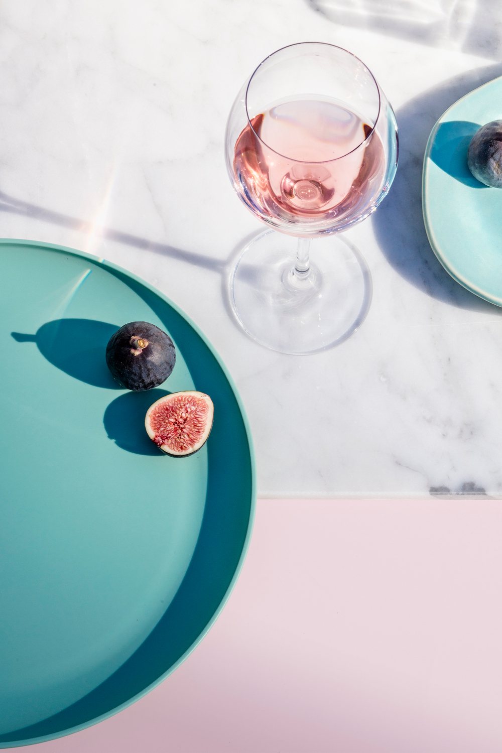 Color blocking, pinks and teals, using shadows in composition, Tabletop styling and food photography Rose and figs