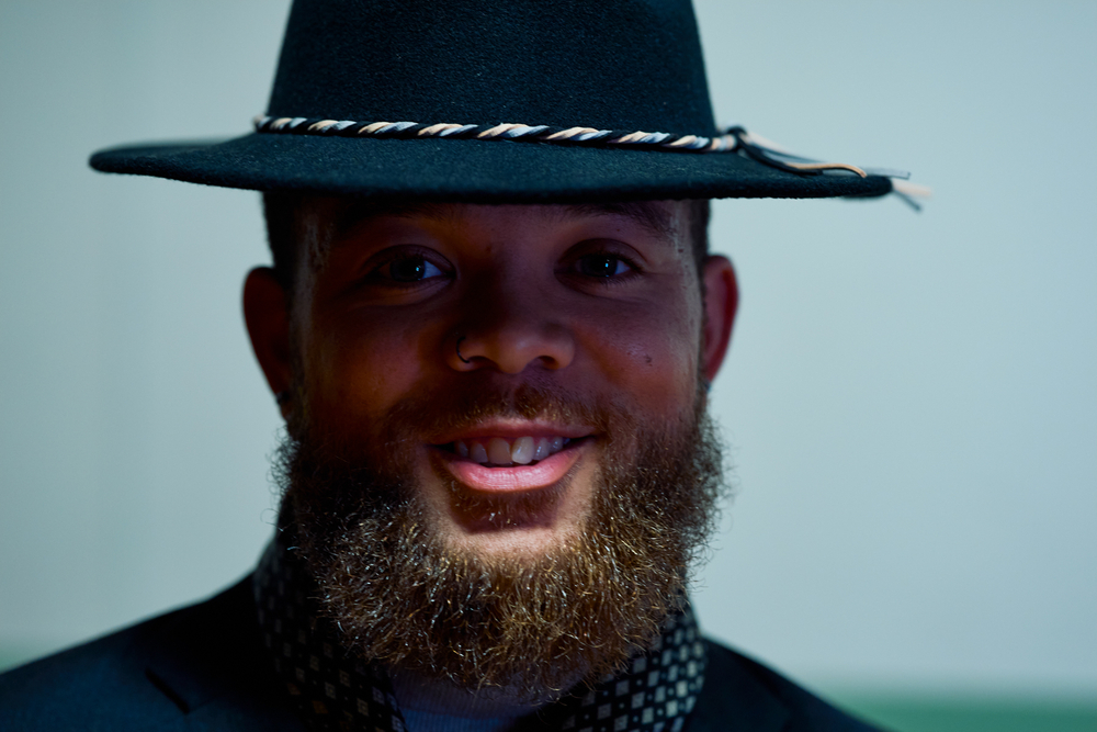 male model with ginger beard and black hat 
