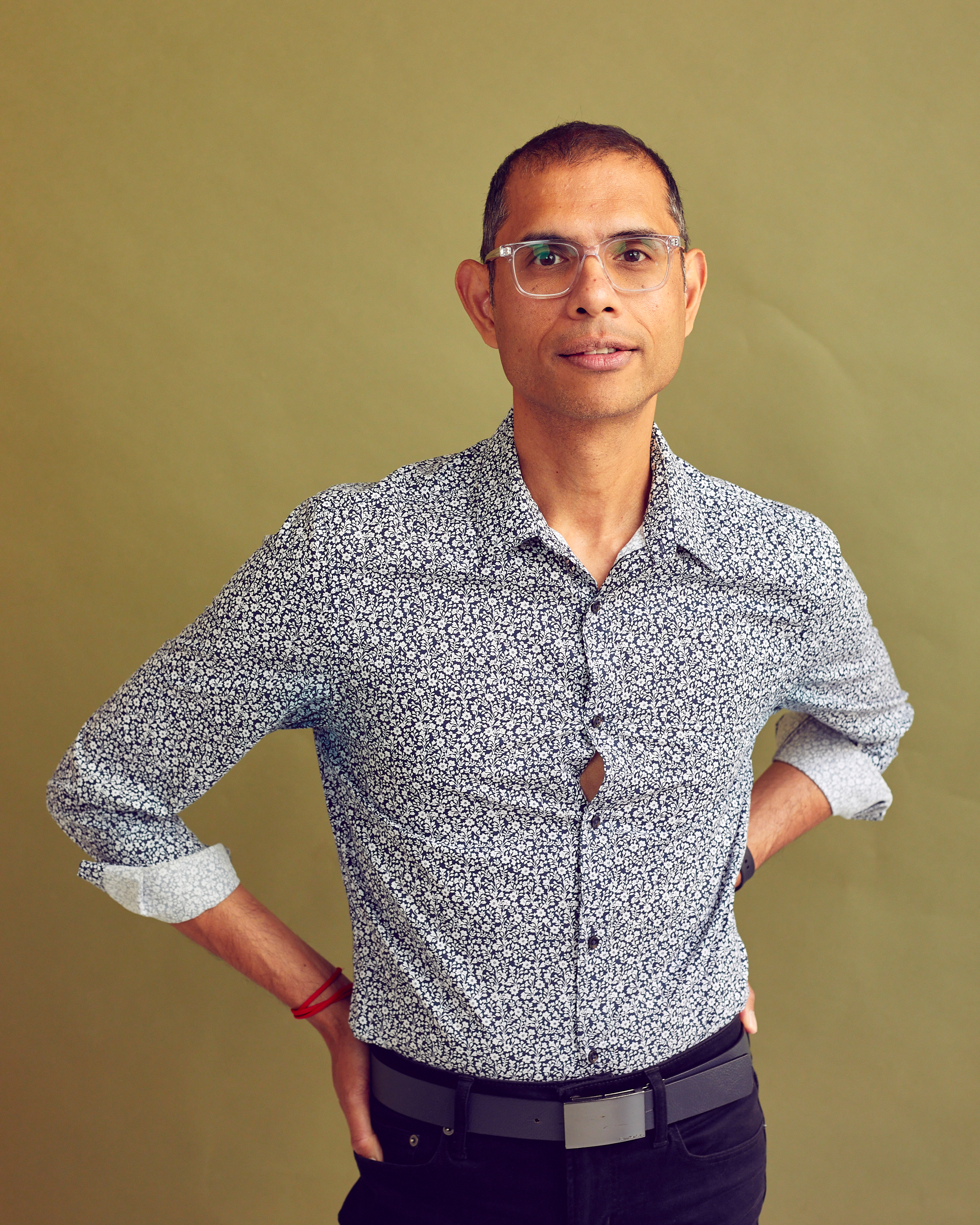 portrait of a man on green backdrop 