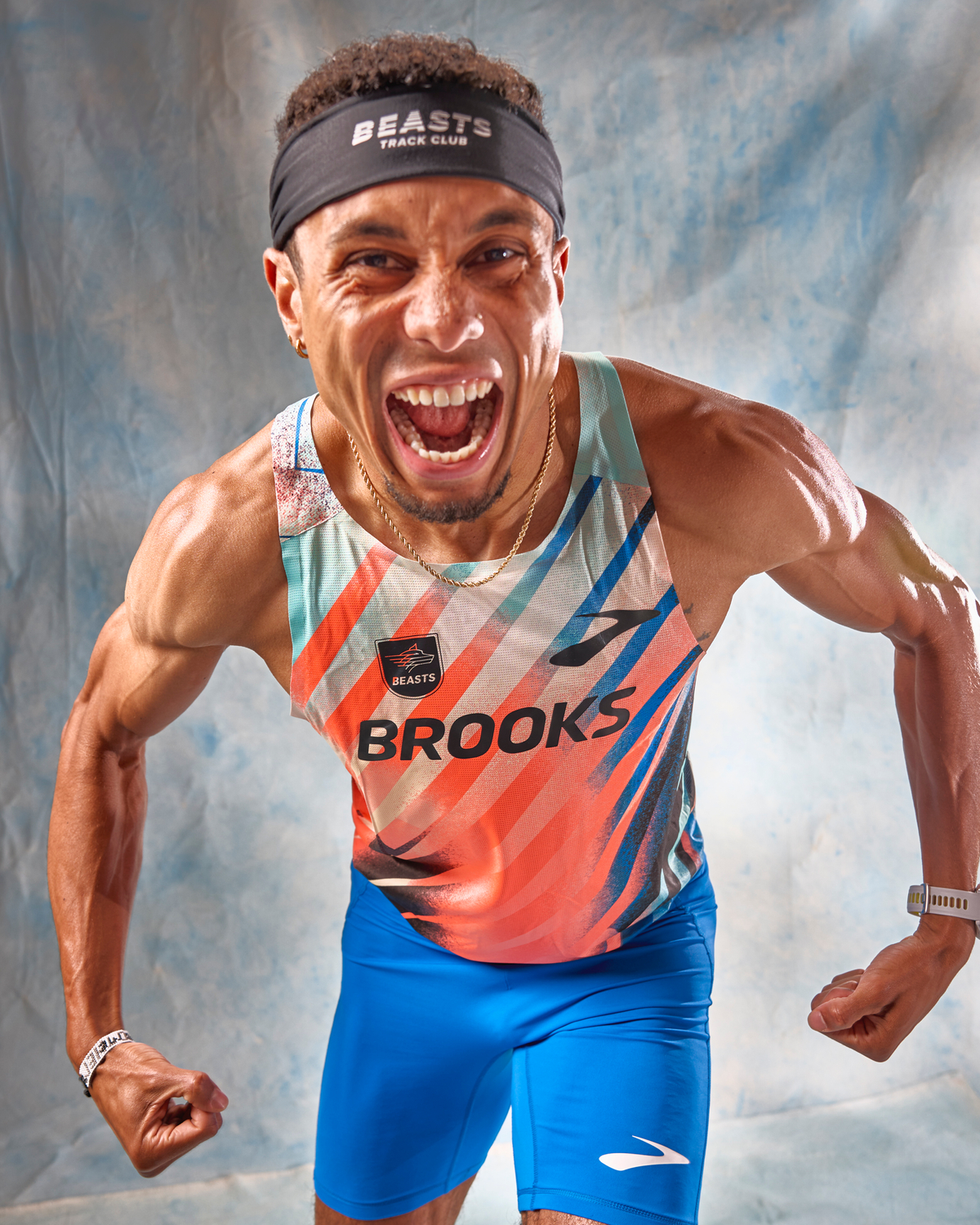 man yells into camera as he gets pumped for a run in brooks running gear 