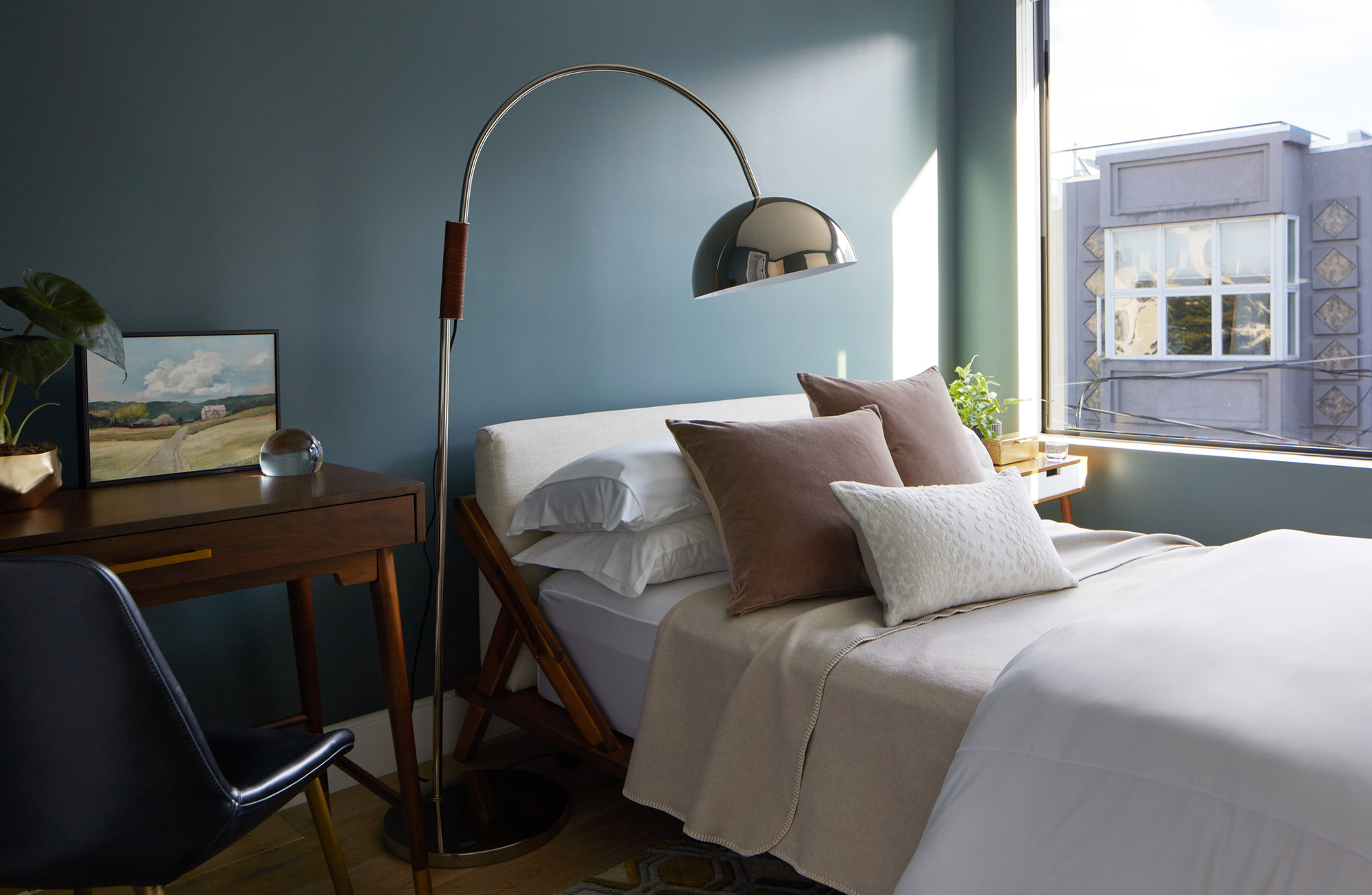 Bed in front of window