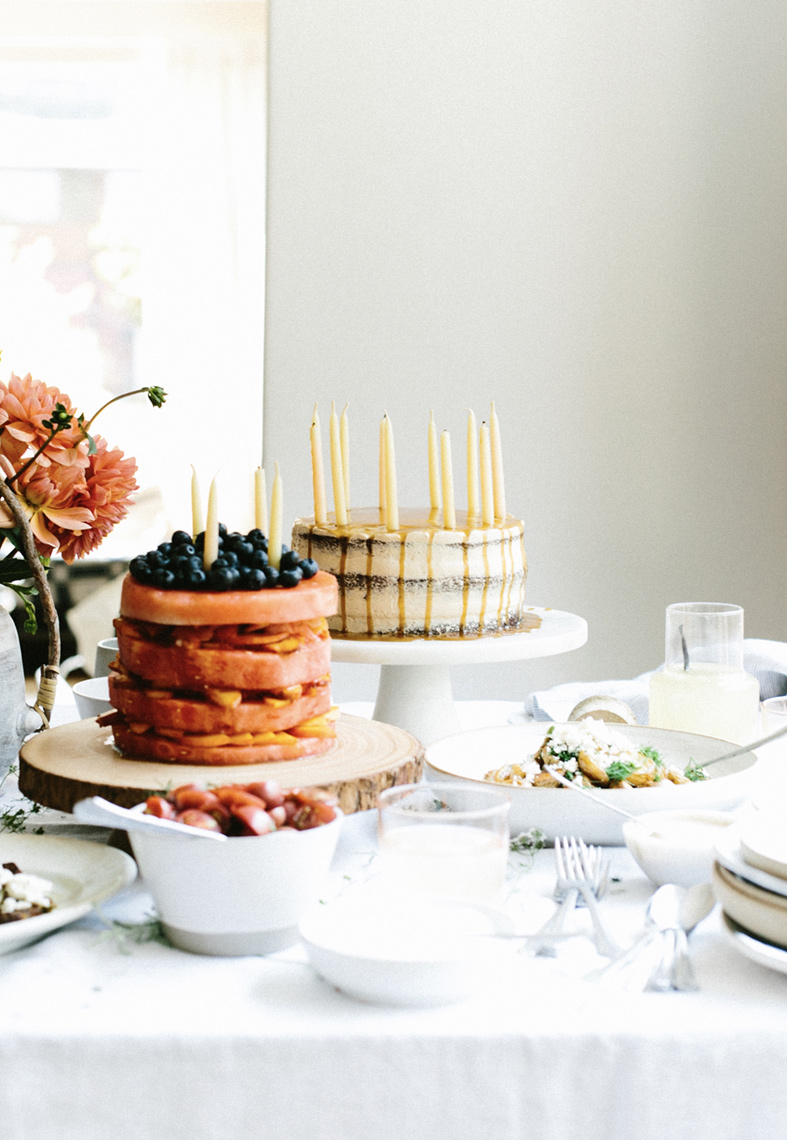 Layer cakes with candles tablescape