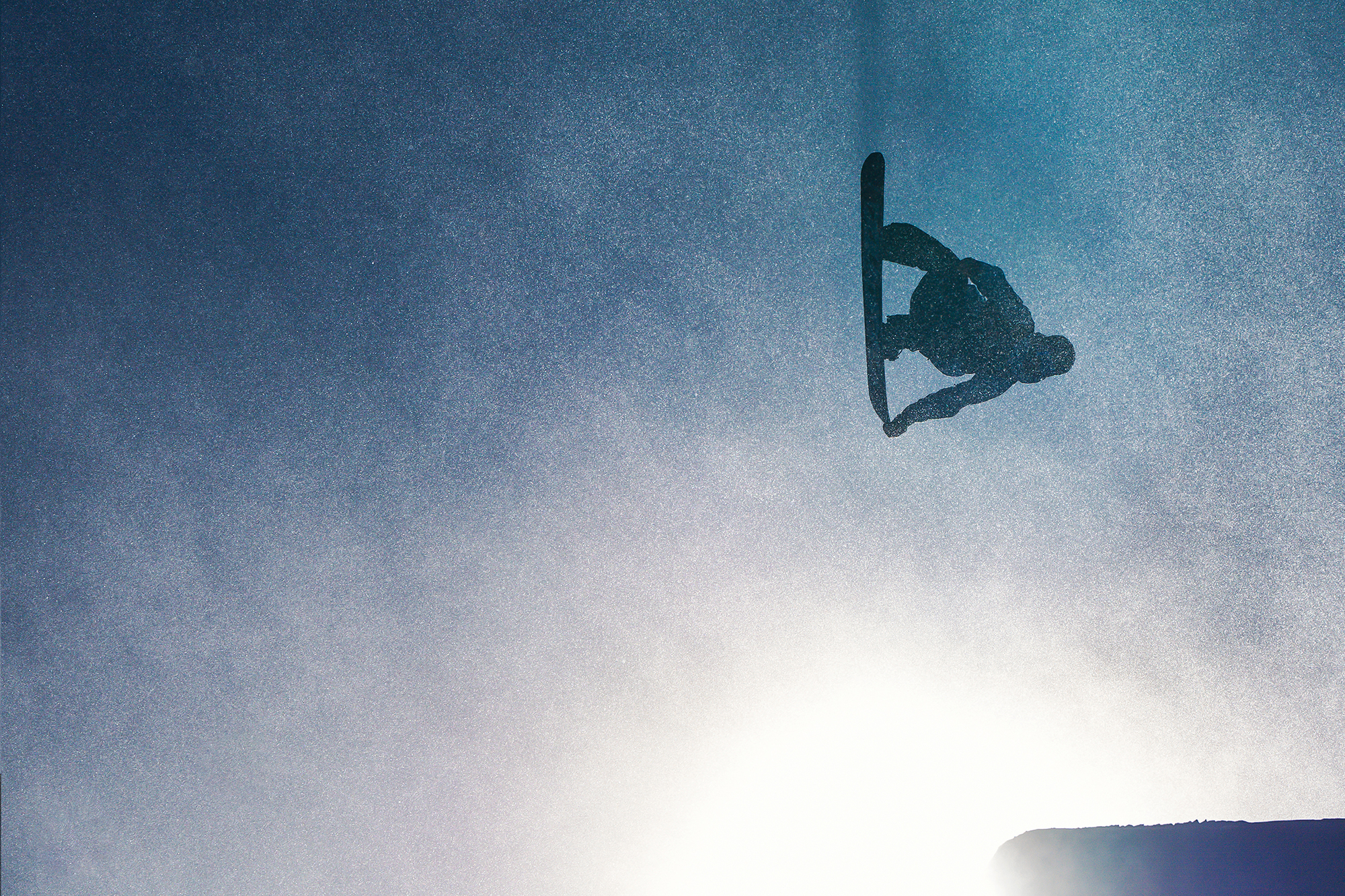 snowboarders flipping in the sun 