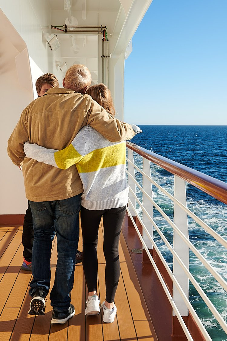 Two people embrace on deck 