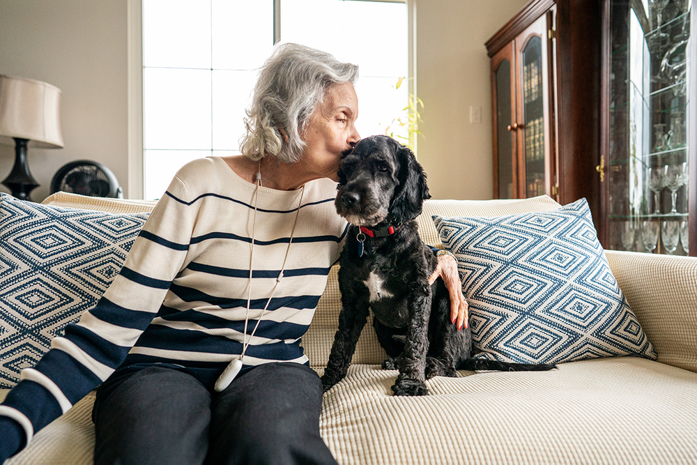 elderly woman with her dog 