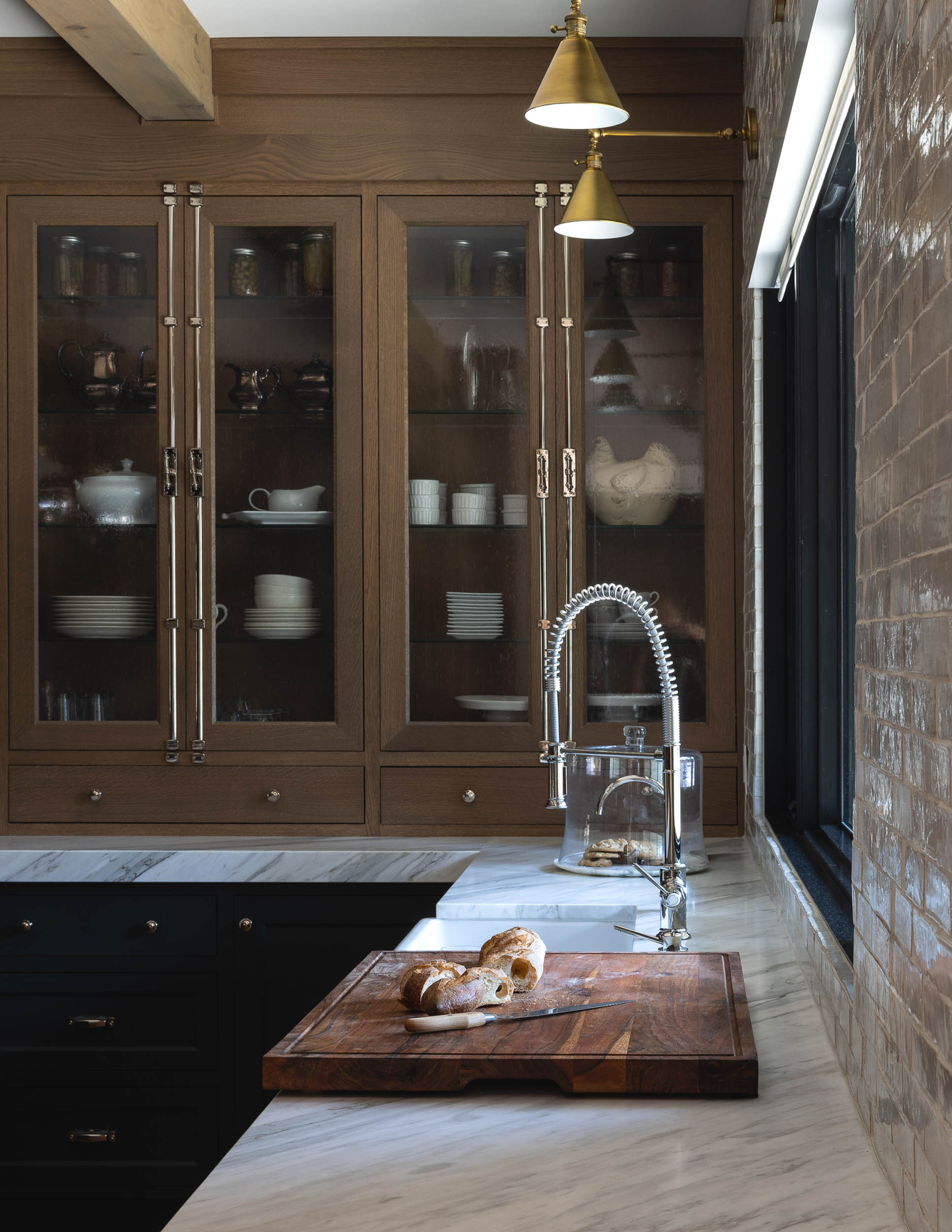 butlers pantry kitchen with marble countertop 