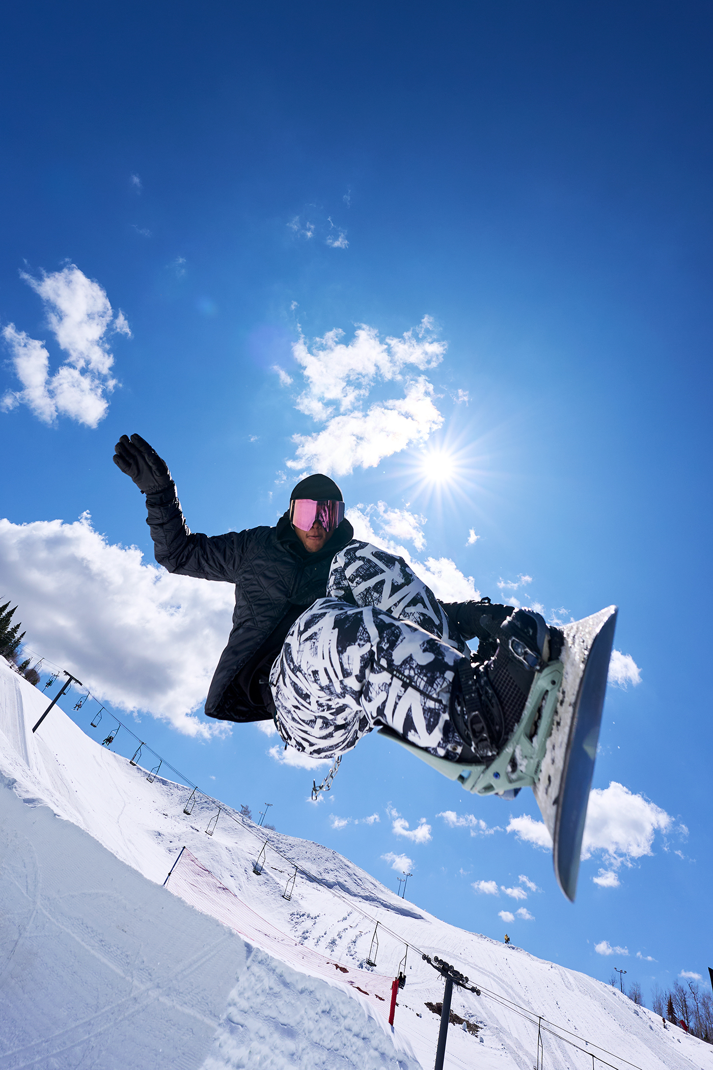 snowboarder gets some air on the first course of the season winter wonderland