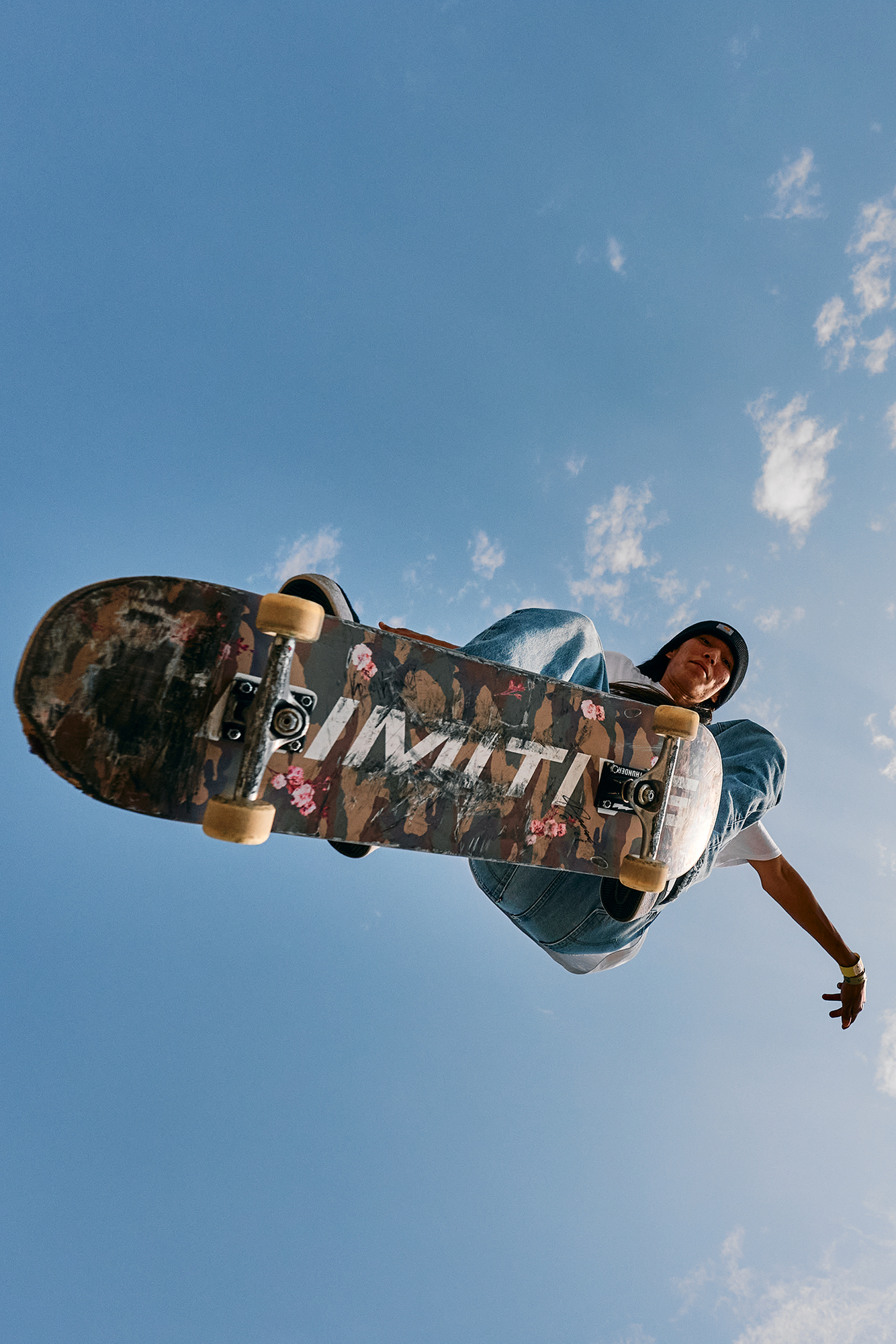 seattle based lifestyle and sports photographer Troy Nebeker for BumperShoot skateboarder flys overhead at bumpershoot
