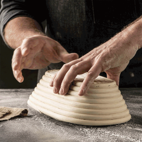 Releasing dough from the coiled cane brotform pan