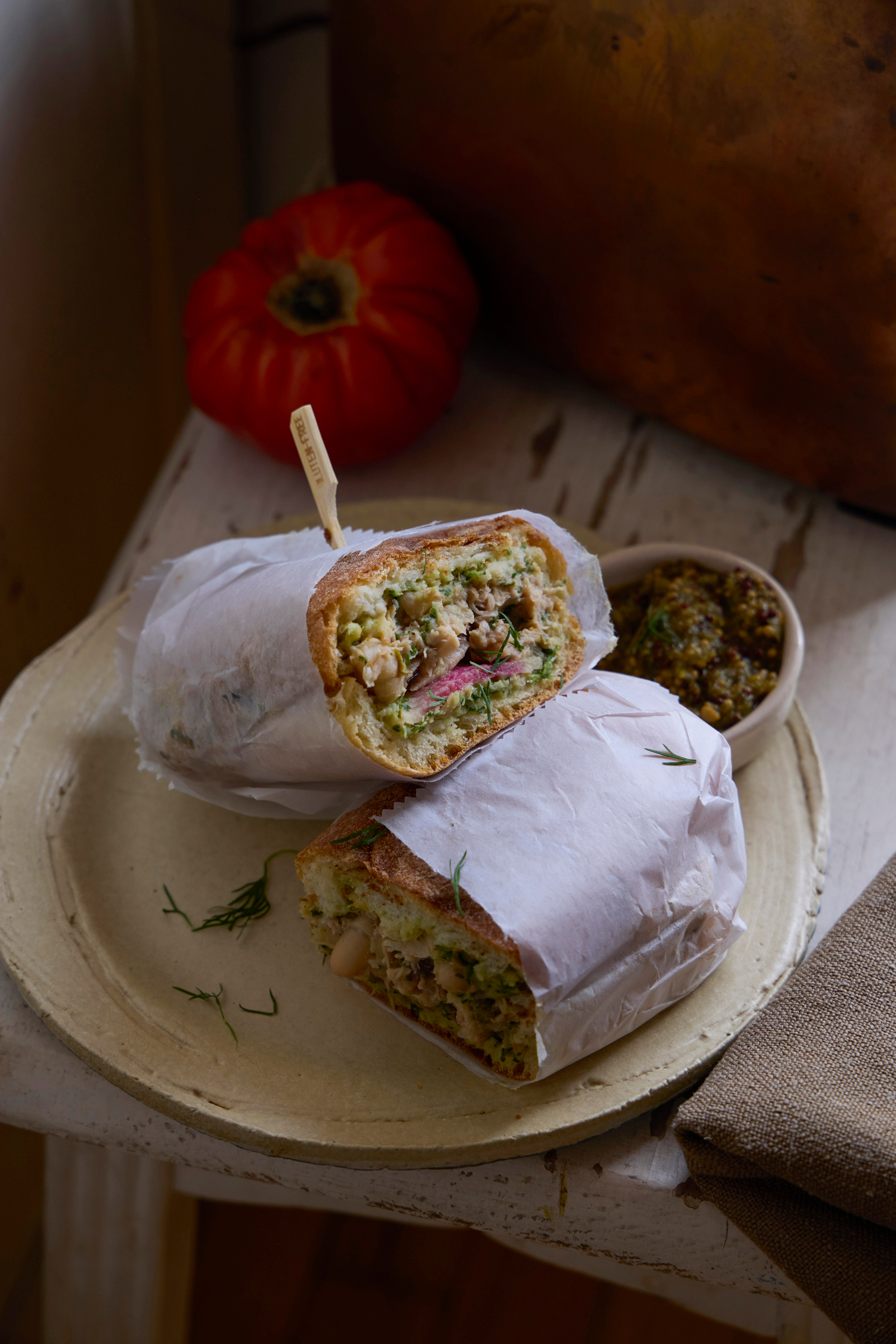 delicious wrap sandwhich wrapped in white paper photogaphed by George Barberis Brooklyn Arts by George Barberis