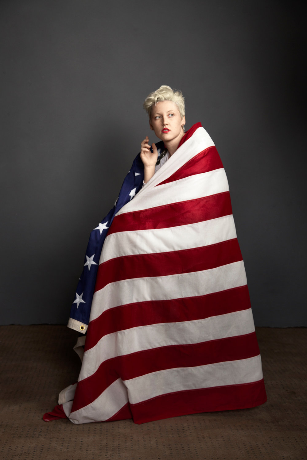 woman wrapped in USA flag 