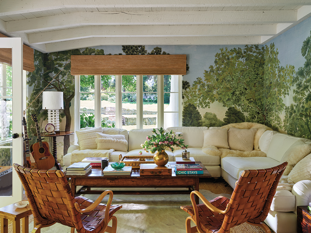 beautiful whimsical living room with mural wall paper 