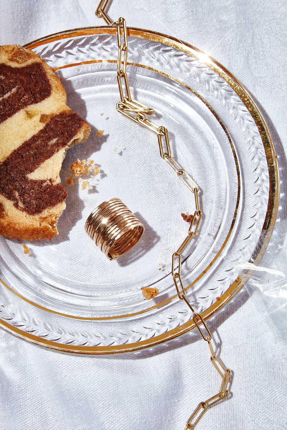 Shiny, shimmering and soulful styling for jewelry advertising. Half eaten slice of bread