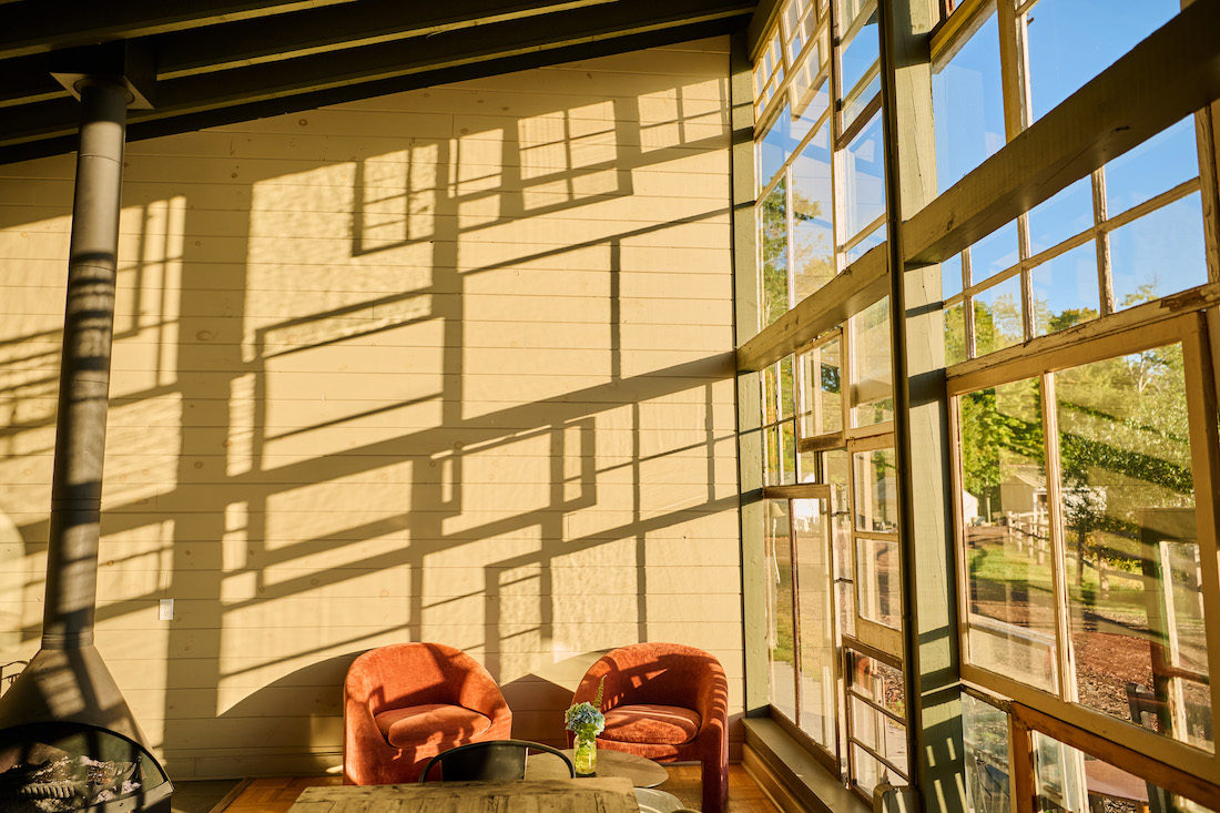sunroom sitting area with orange chairs  Sarah Flotard - Seattle Based Commercial Lifestyle Food And Beverage Photographer