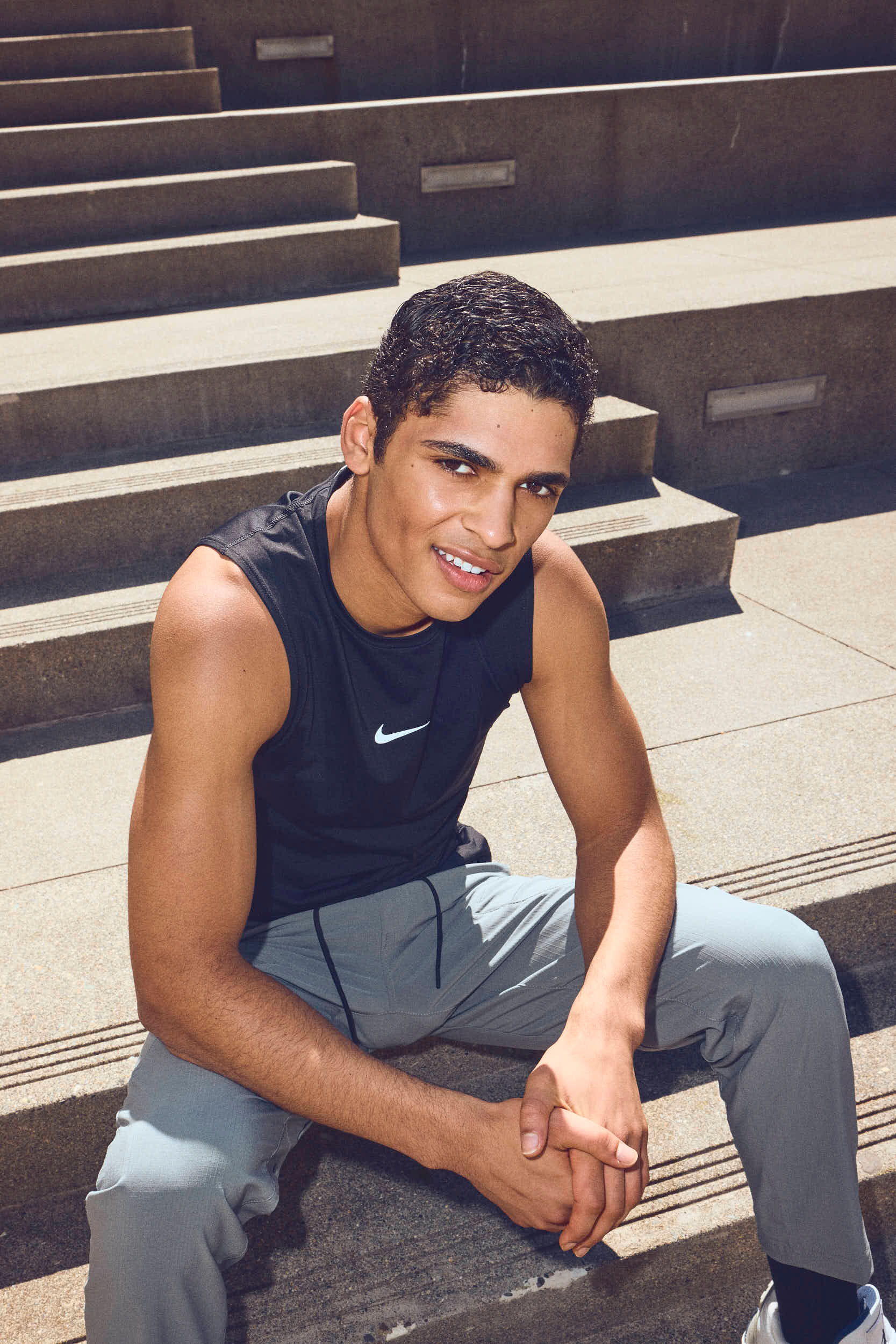 black Nike tank top with grey nike sweatpants and jordan 