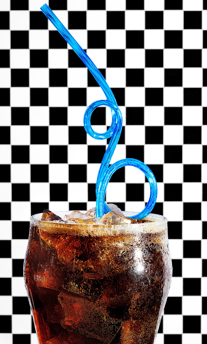 Refreshing coke with a blue straw