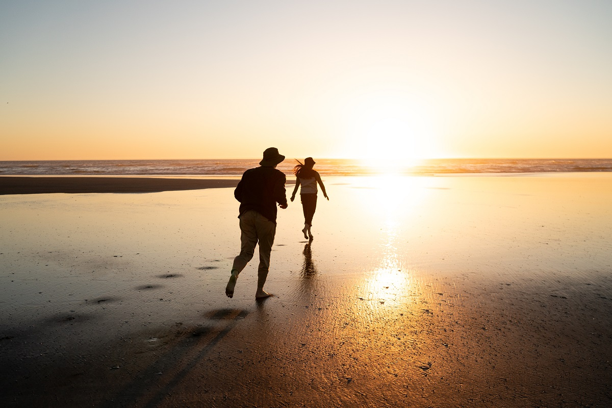 Couple running on the beach