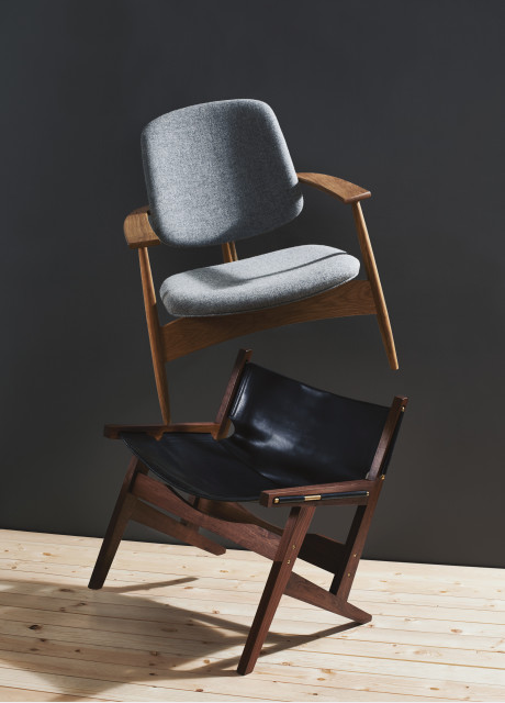 Black leather chair with dark solid wood and soft grey chair 