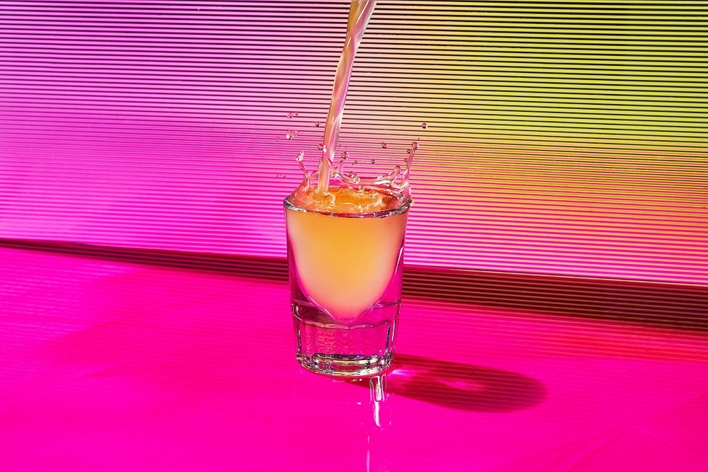 liquor pouring into a shot glass