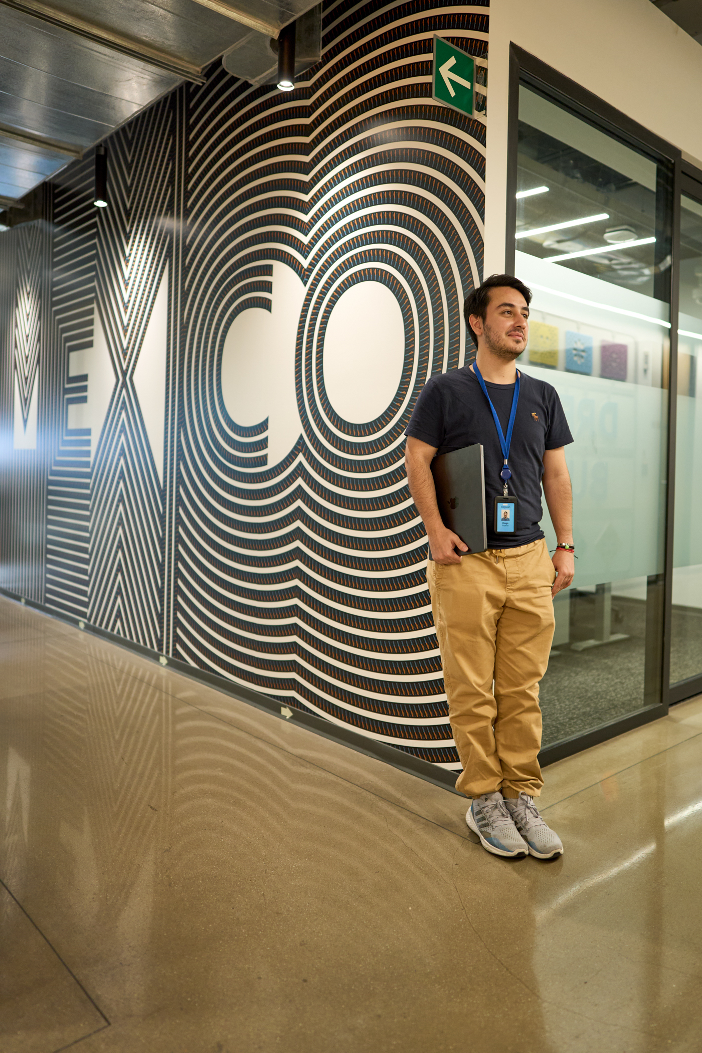 man leans agains a mexico wall at work 