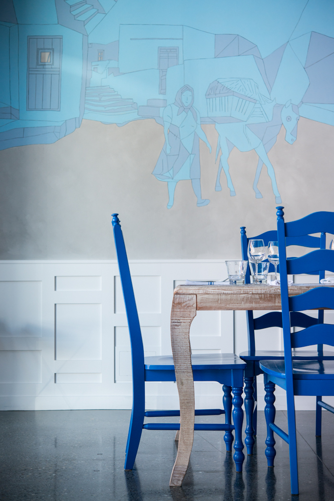 Blue chairs at wood table