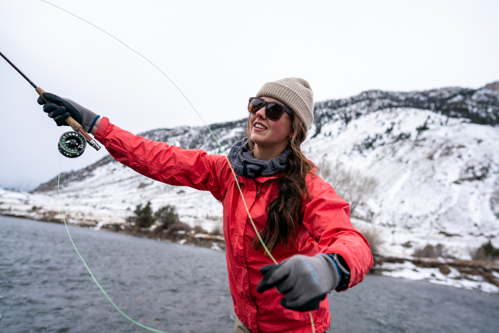Young woman fly fishing in Montana