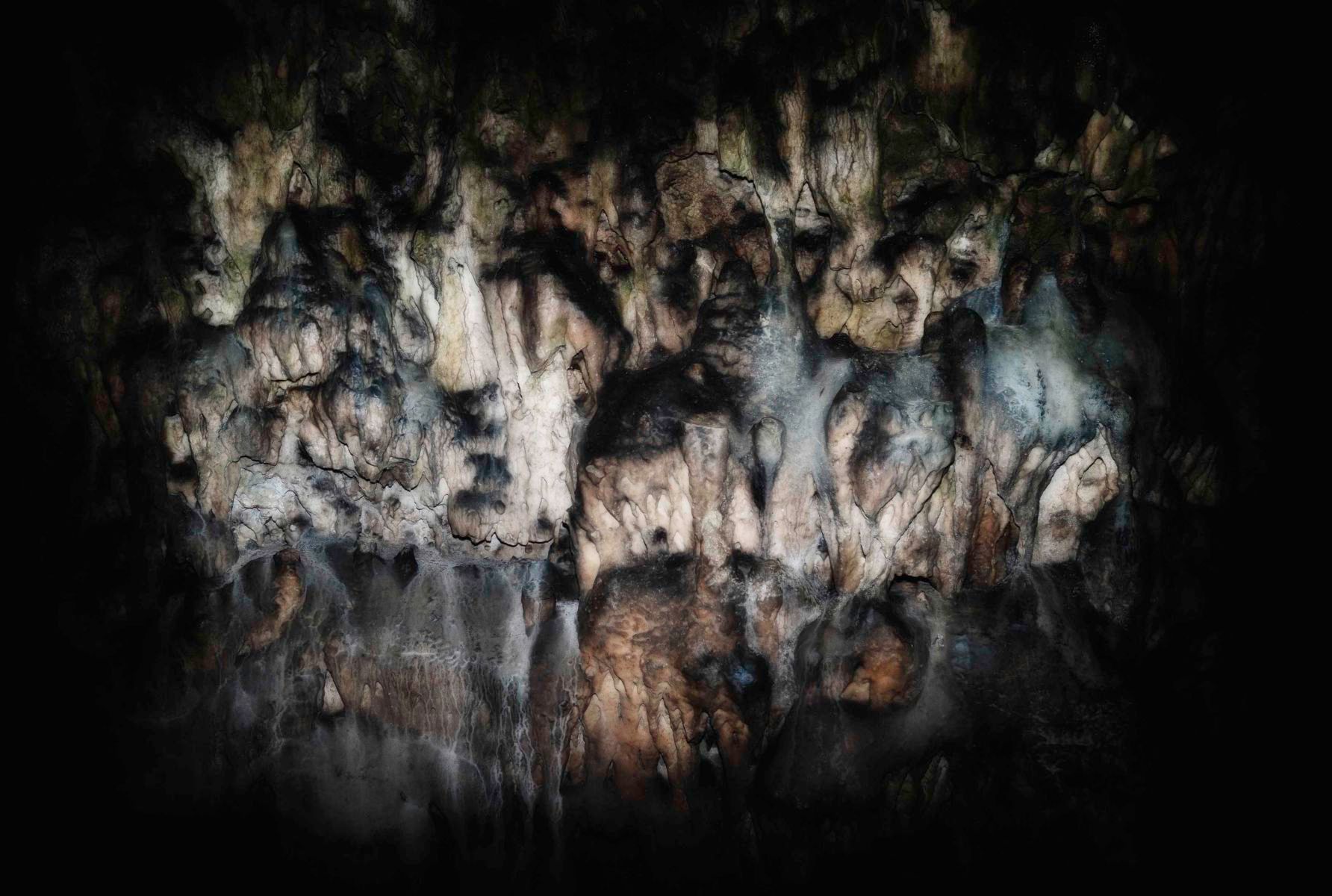 Photograph of cave stalagmites from Micha Warren’s artist book God Is Never Far Away, evoking memory, mystery, and the hidden landscapes of the subconscious. Cave stalagmites – “God Is Never Far Away”