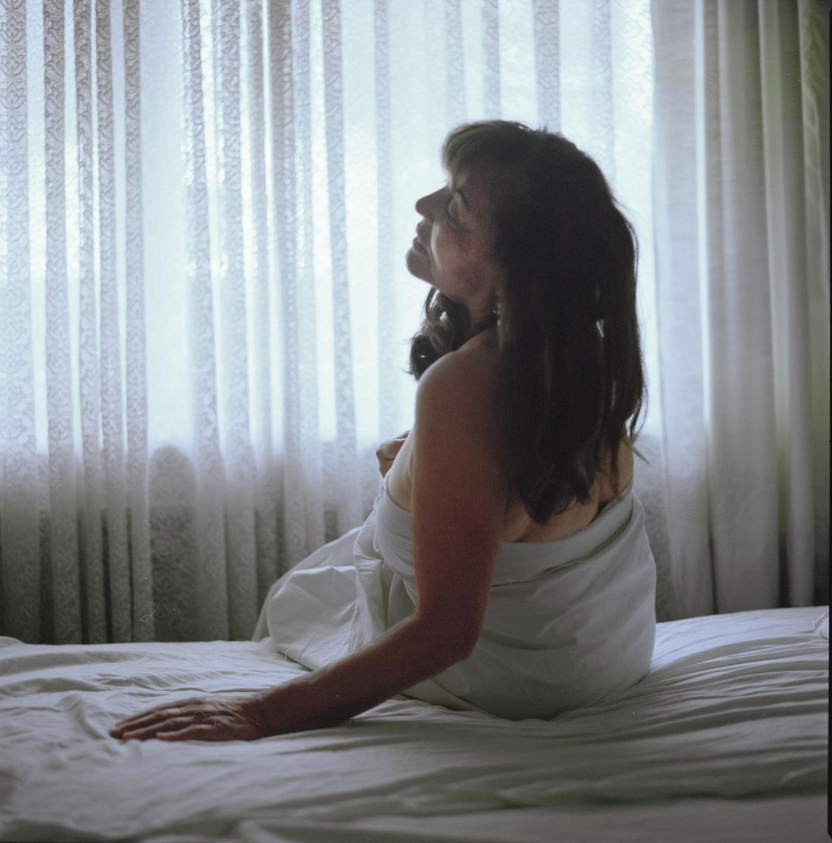Mother sitting in morning light – “God Is Never Far Away”