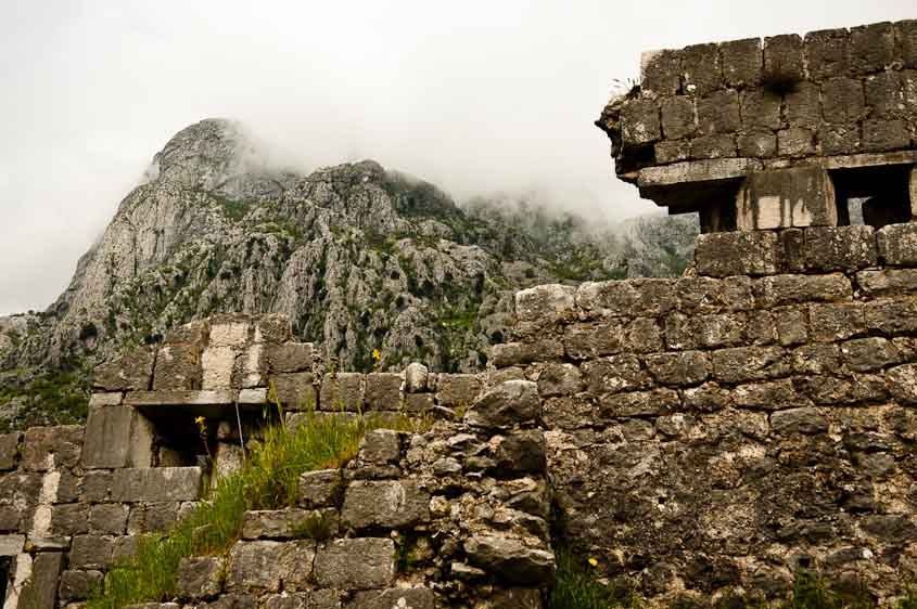 Misty mountain among ruins