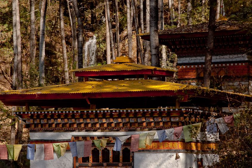Waterfall, pagoda, and prayer flags